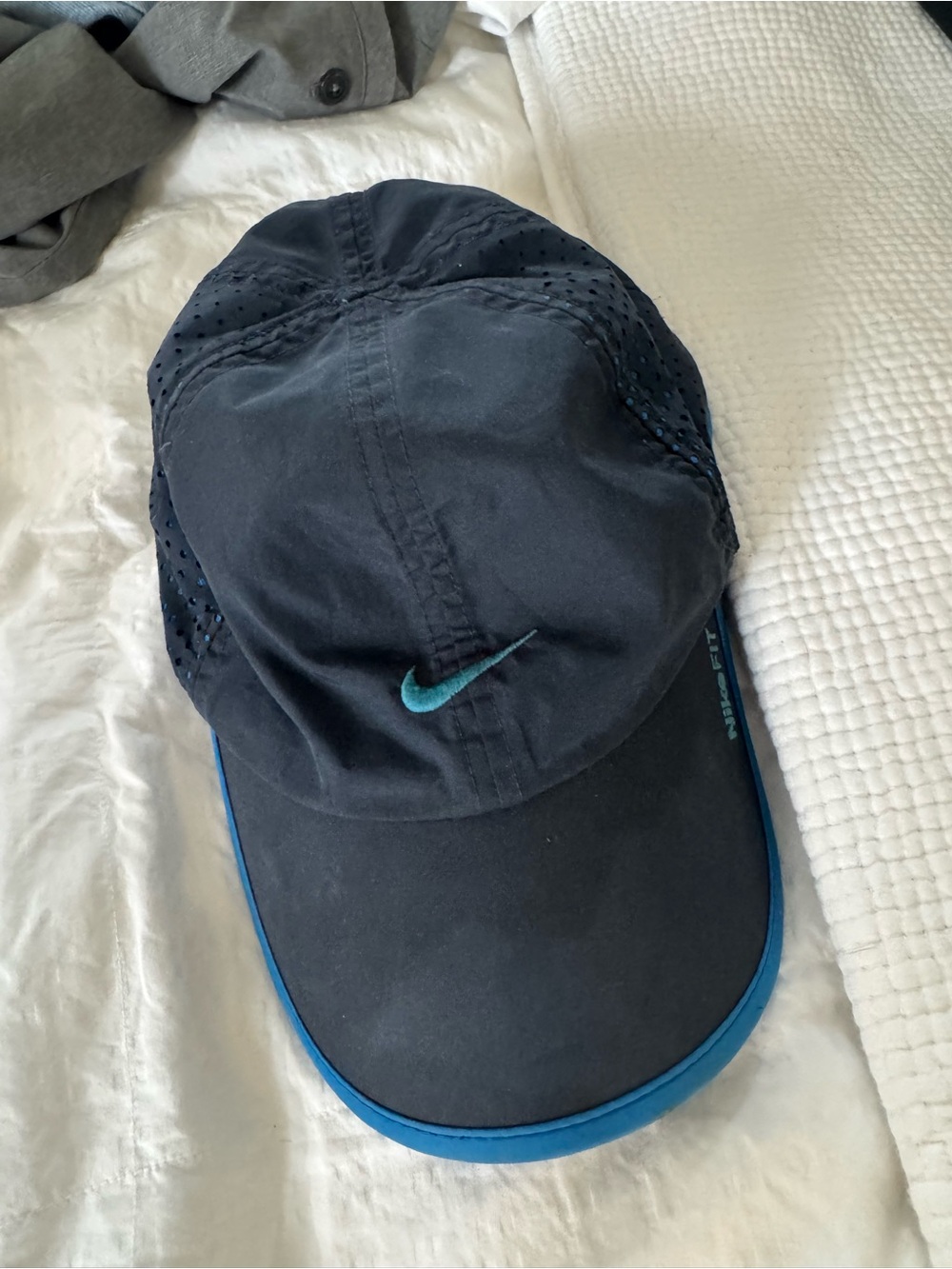 Nike Men’s Black Cap with Teal Swoosh and Blue Trim
